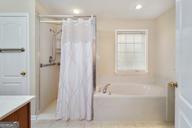 bathroom featuring tile patterned flooring, vanity, and independent shower and bath