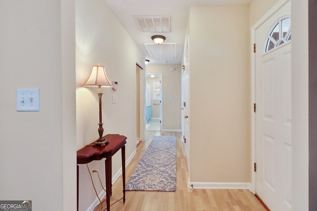 corridor featuring light hardwood / wood-style floors