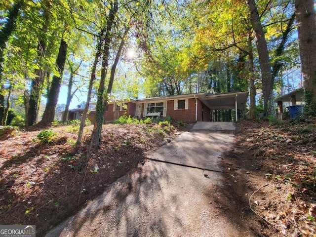 ranch-style house with a carport