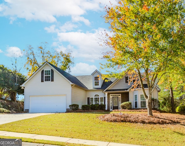 view of front of home featuring a garage and a front lawn