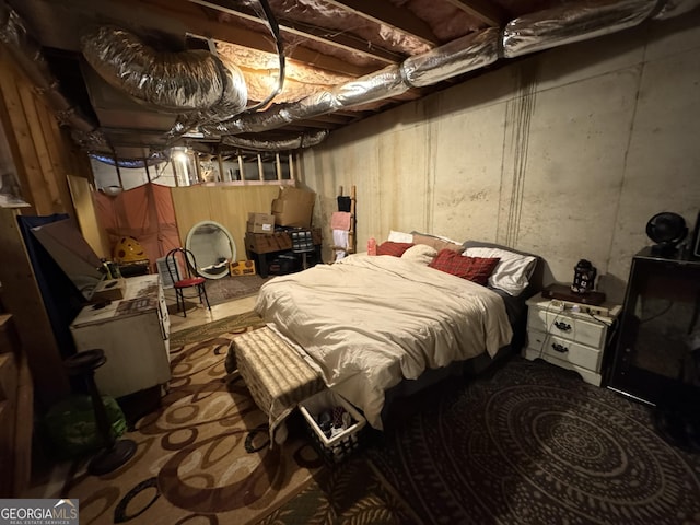 bedroom featuring concrete floors