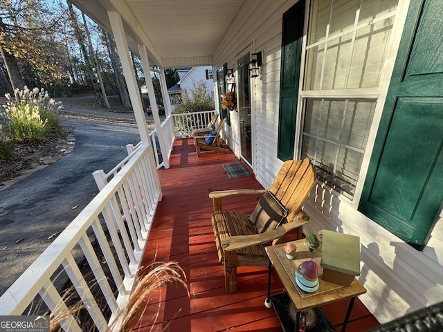 wooden deck featuring covered porch