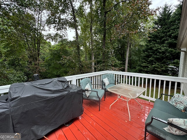 wooden deck featuring area for grilling