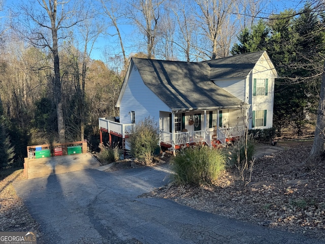 view of side of property with covered porch