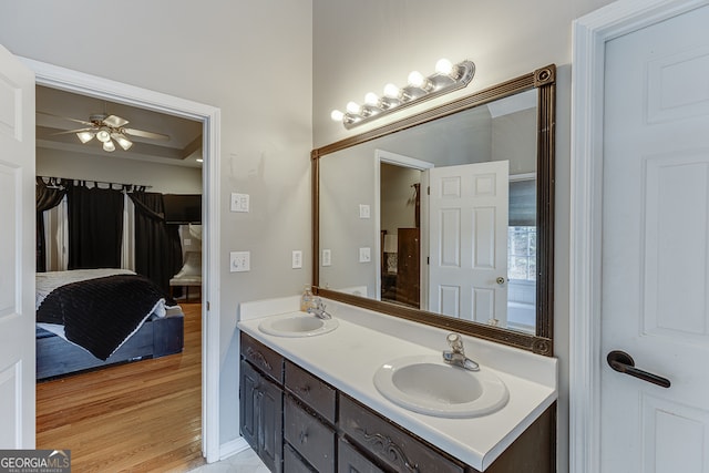 bathroom featuring hardwood / wood-style floors, ceiling fan, and vanity