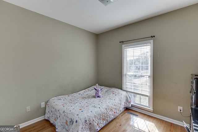 bedroom featuring hardwood / wood-style floors