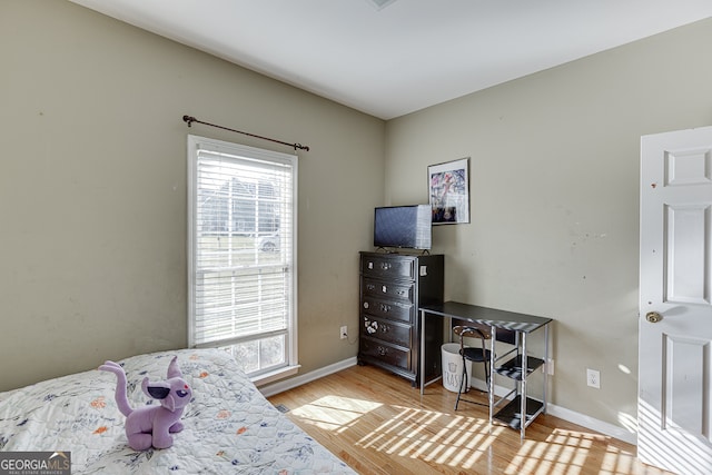 bedroom featuring light wood-type flooring