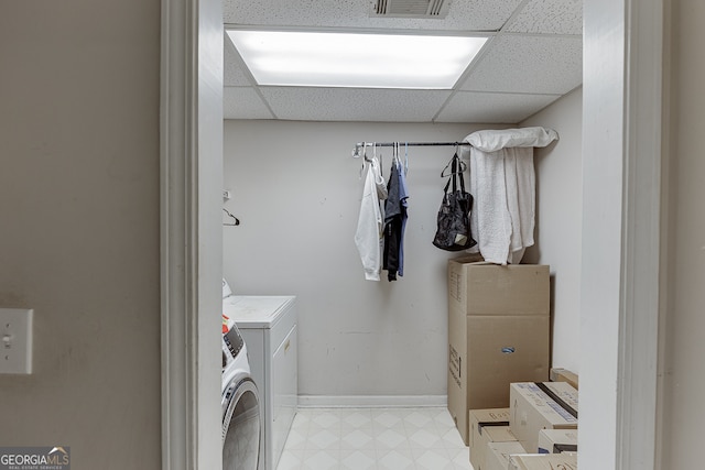 laundry room with washing machine and clothes dryer