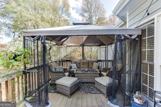 deck featuring a gazebo and an outdoor hangout area