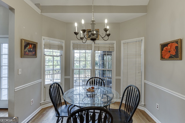 dining area featuring a chandelier and hardwood / wood-style flooring