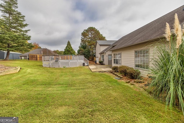 view of yard with a wooden deck