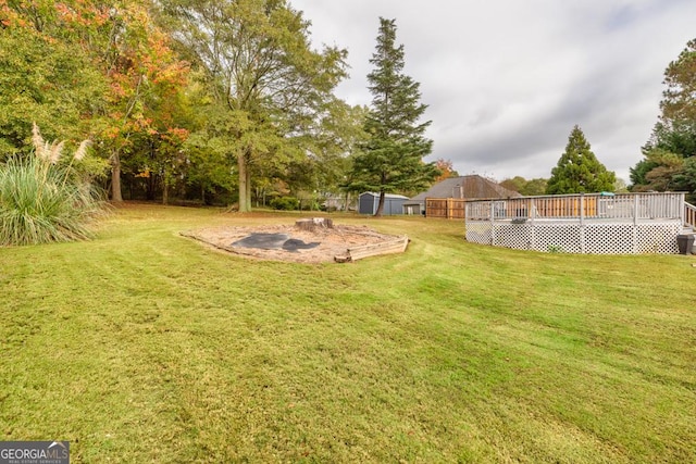 view of yard with a wooden deck