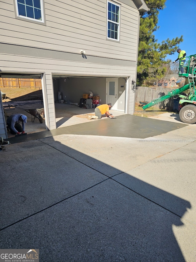 garage with fence