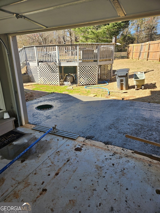 view of patio / terrace featuring fence and a wooden deck