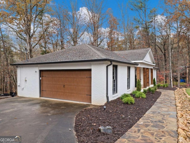 view of property exterior with a garage