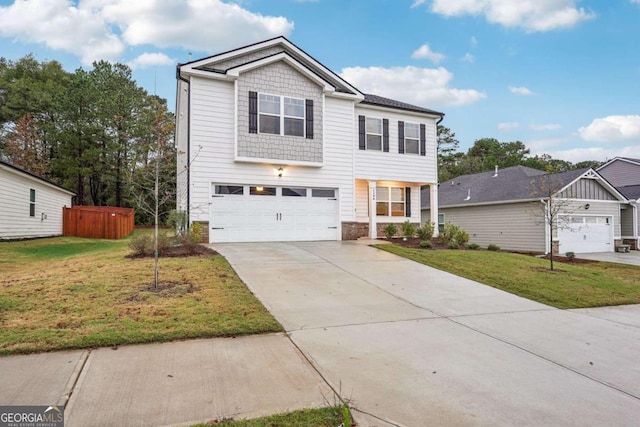 view of front of property with a garage and a front yard