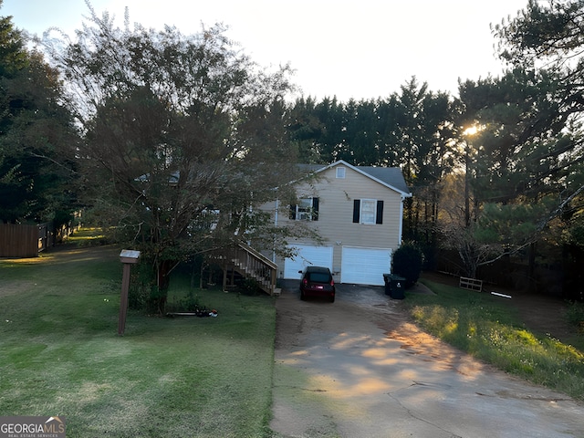 view of front facade with a garage and a front yard