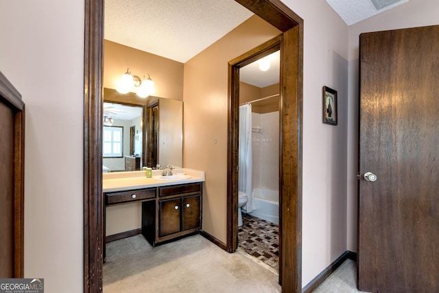 full bathroom featuring vanity, a textured ceiling, toilet, and shower / bath combo with shower curtain