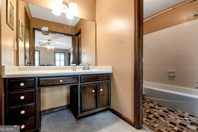 bathroom featuring shower / bathing tub combination, vanity, and ceiling fan