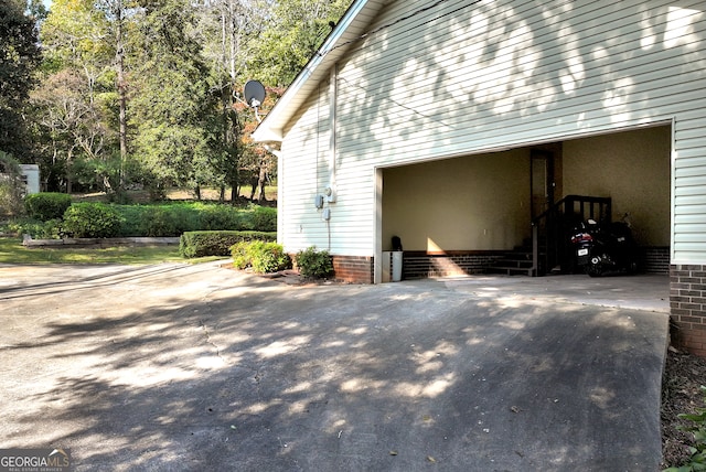 view of home's exterior with a carport