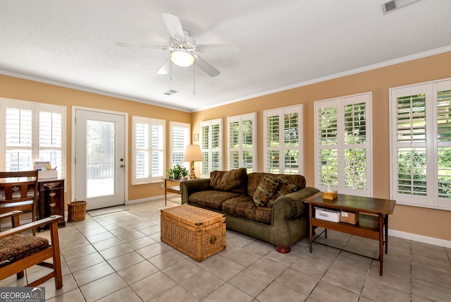 sunroom / solarium featuring ceiling fan