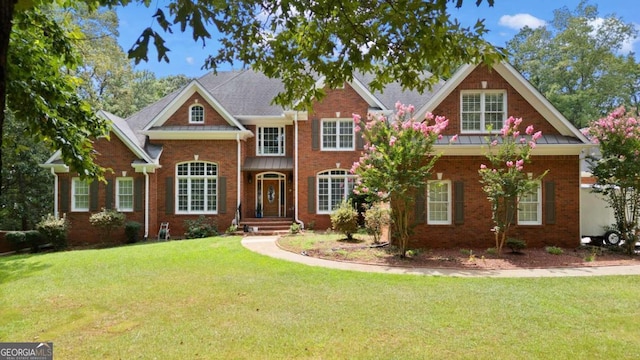 craftsman-style house featuring a front lawn