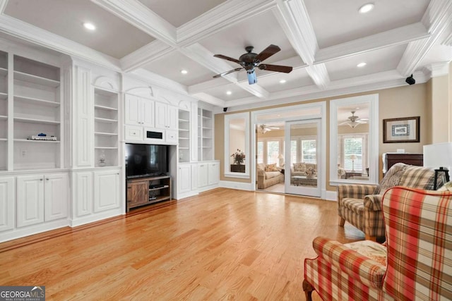 living room with beamed ceiling, light hardwood / wood-style flooring, coffered ceiling, and built in shelves