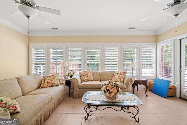 living room featuring ornamental molding and light tile patterned floors