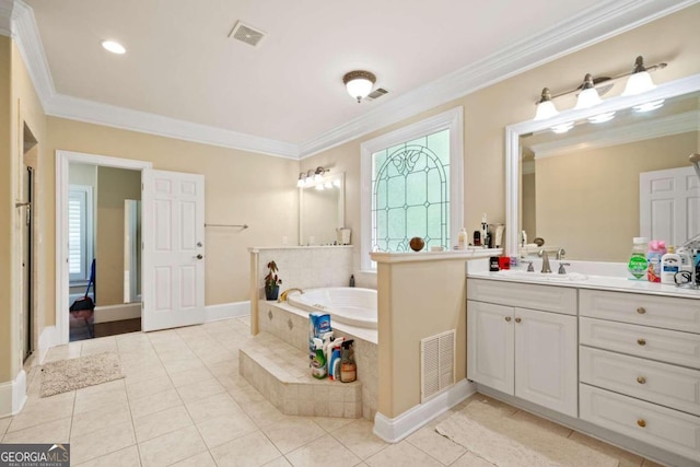 bathroom featuring ornamental molding, tile patterned floors, tiled tub, a healthy amount of sunlight, and vanity