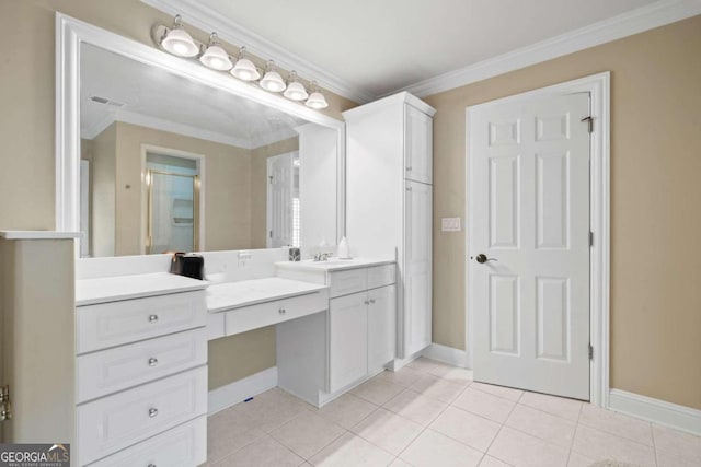 bathroom featuring ornamental molding, tile patterned flooring, and vanity