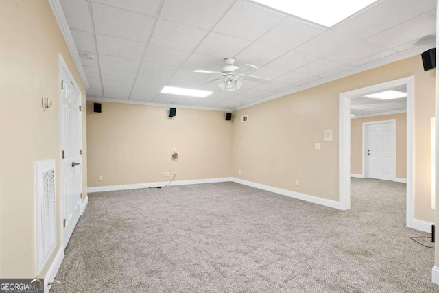 unfurnished room with a paneled ceiling, ceiling fan, and light colored carpet