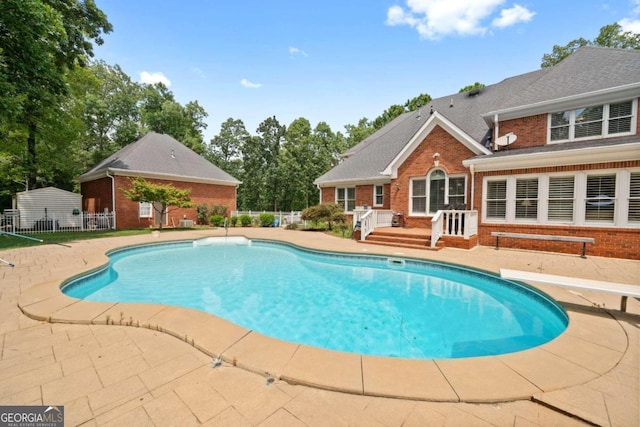 view of swimming pool featuring a patio