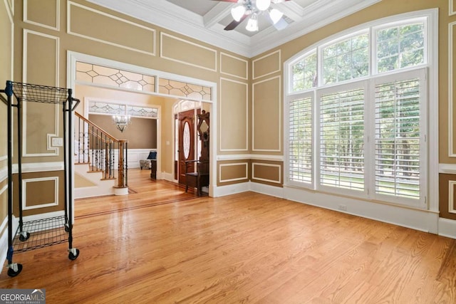 interior space with beam ceiling, ornamental molding, and plenty of natural light