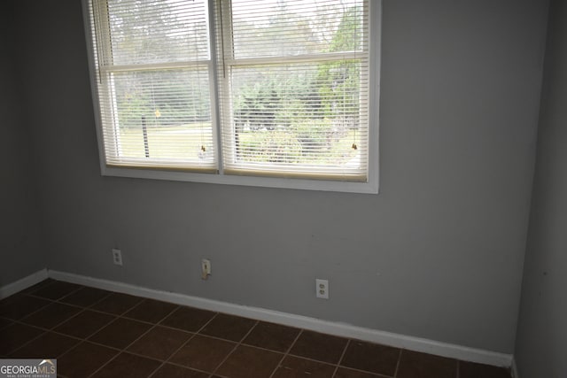 unfurnished room with tile patterned floors