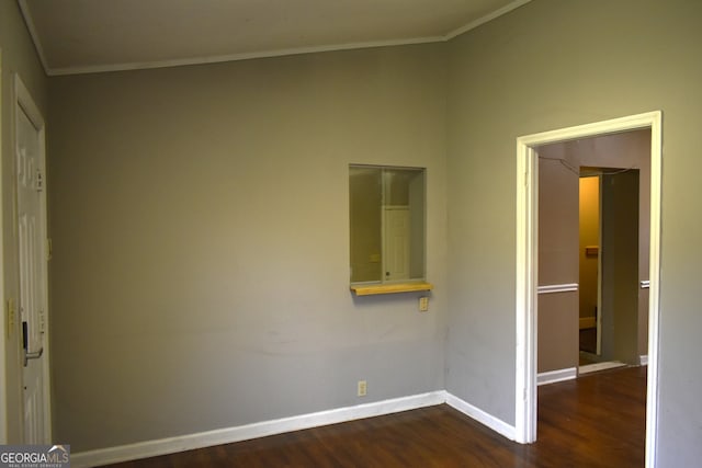 unfurnished bedroom featuring dark hardwood / wood-style floors and ornamental molding