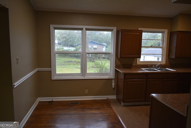 kitchen featuring sink and wood-type flooring