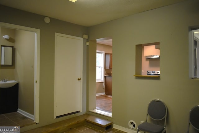 bathroom with tile patterned flooring and sink