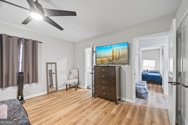 living area featuring ceiling fan and light wood-type flooring