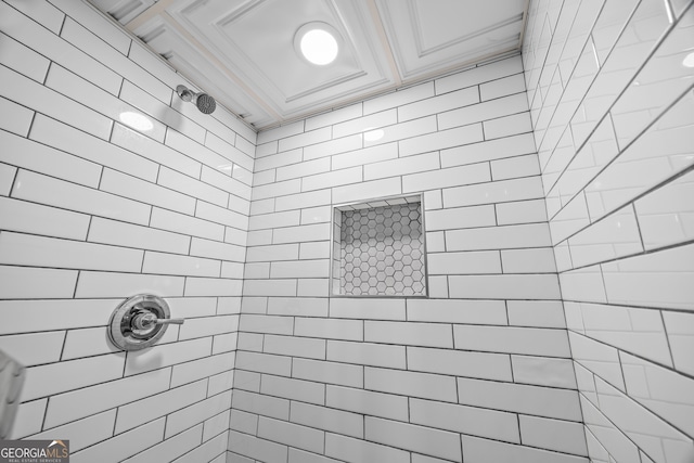 bathroom featuring tiled shower