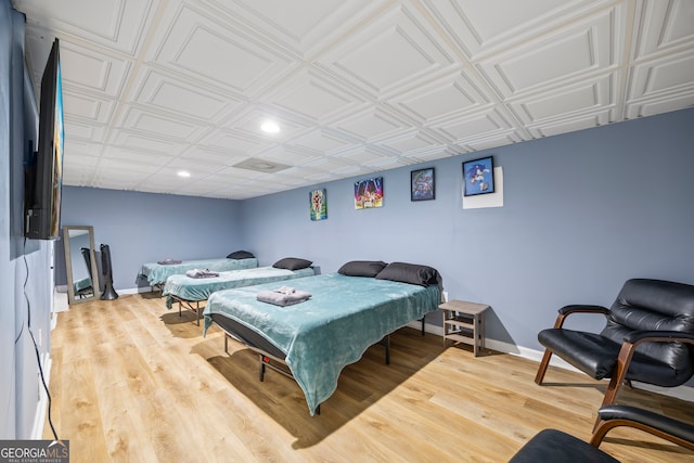 bedroom with hardwood / wood-style flooring