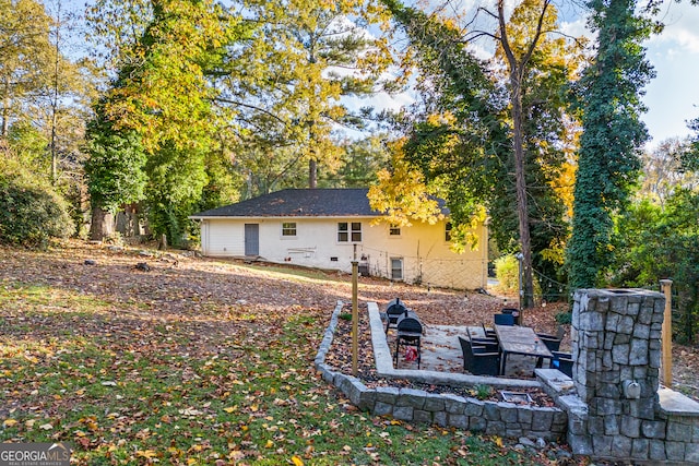 back of property with a patio