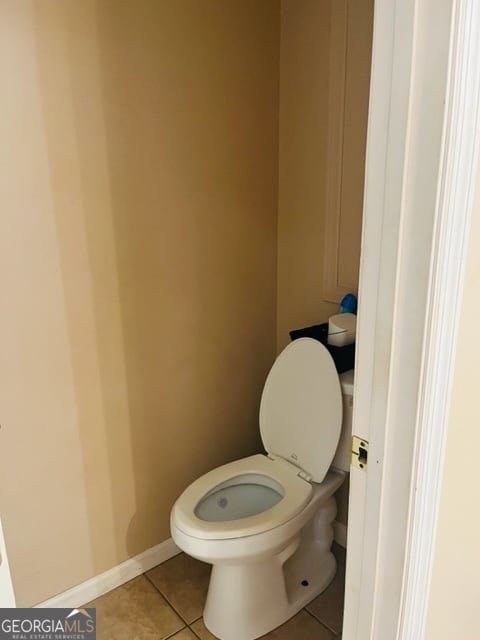 bathroom featuring tile patterned floors and toilet