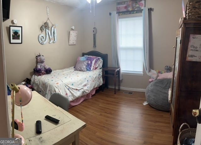 bedroom featuring hardwood / wood-style floors