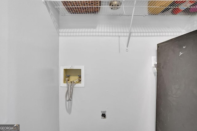 laundry room with hookup for an electric dryer and hookup for a washing machine