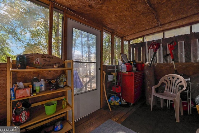 sunroom / solarium featuring lofted ceiling