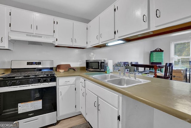 kitchen featuring white cabinetry, stainless steel appliances, light hardwood / wood-style floors, and sink