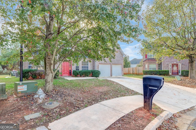 obstructed view of property with a garage