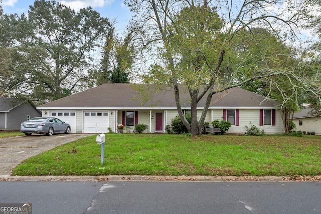 ranch-style home featuring a garage and a front yard