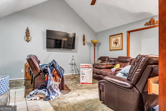 living room with a textured ceiling, tile patterned floors, and lofted ceiling