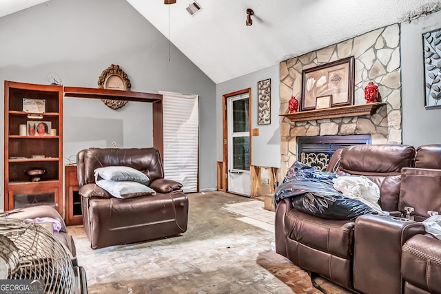 bedroom featuring a fireplace and high vaulted ceiling